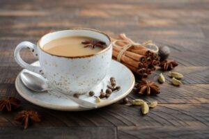 a cup of masala tea with some spices